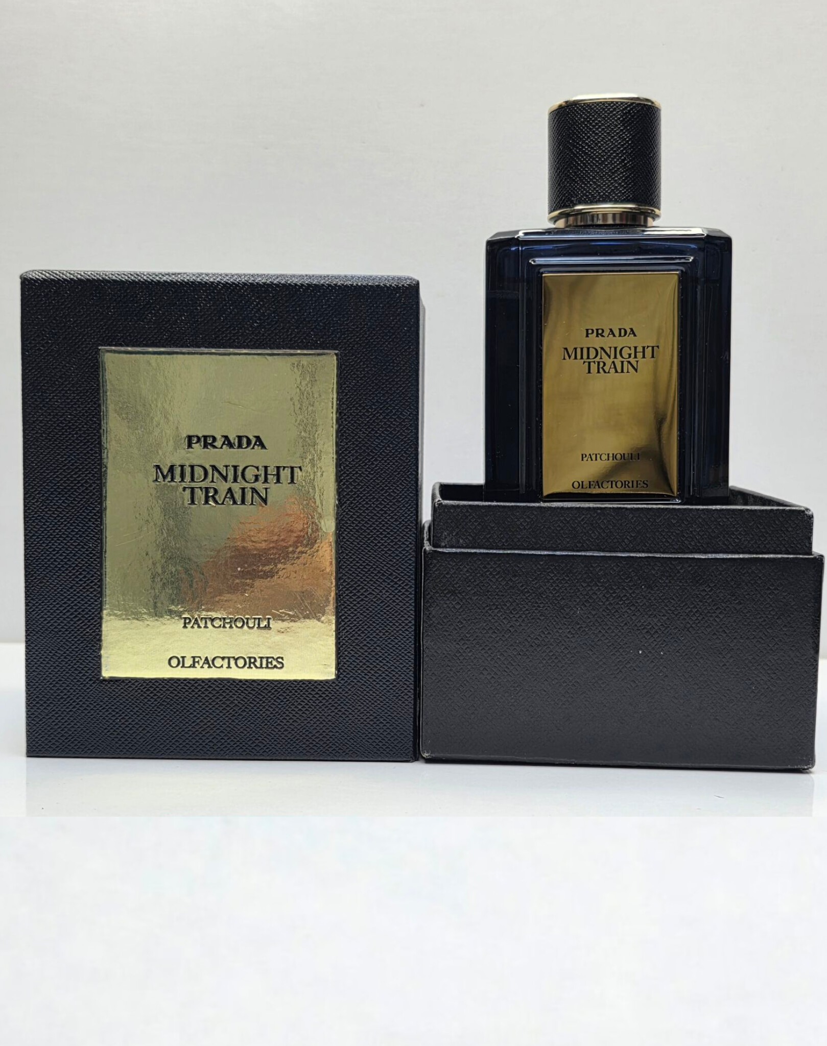 InShot_20260509_114423252 ادکلن پرادا میدنایت ترین 100 میل | PRADA Midnight Train - عطری گرم و چوبی - Image 1